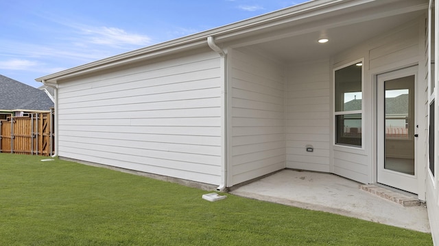 exterior space with a lawn and a patio