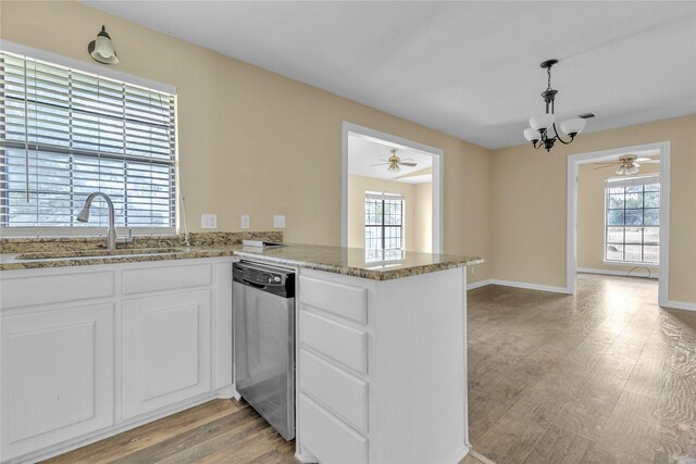 interior space featuring butcher block counters, pendant lighting, white cabinets, and dark wood-type flooring