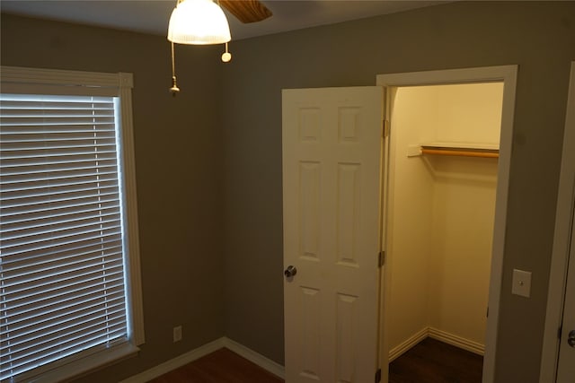 unfurnished bedroom with dark hardwood / wood-style flooring