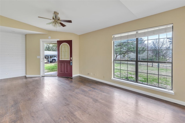 entrance foyer featuring dark wood-type flooring, lofted ceiling, ceiling fan, and baseboards