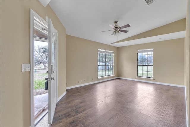 spare room featuring lofted ceiling, ceiling fan, baseboards, and wood finished floors