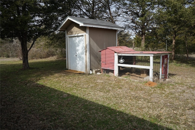 view of poultry coop with a yard