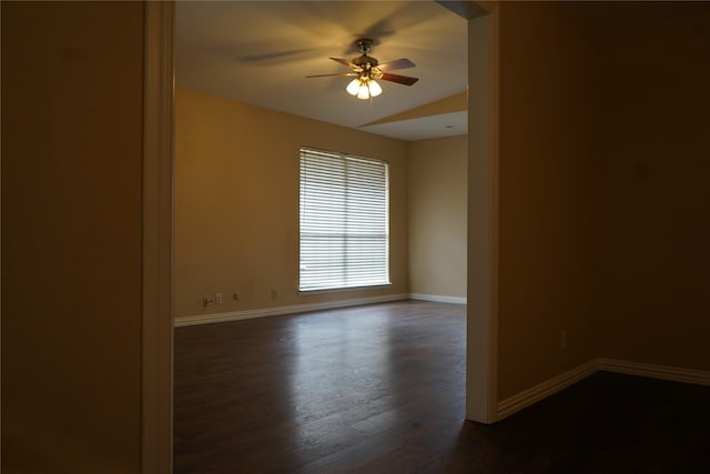 spare room featuring ceiling fan and dark hardwood / wood-style flooring