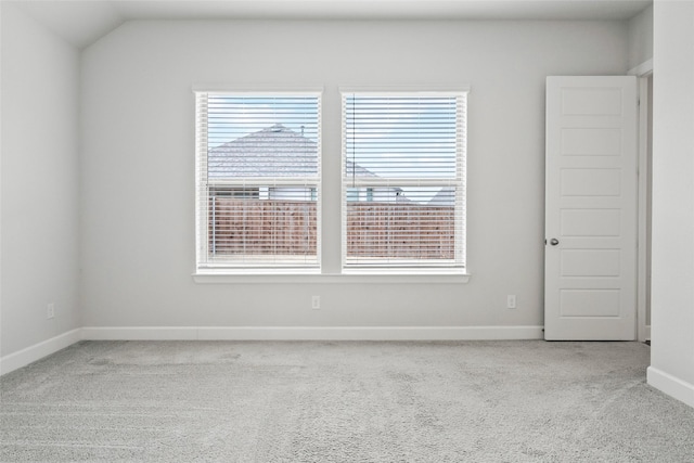 empty room with carpet floors and baseboards