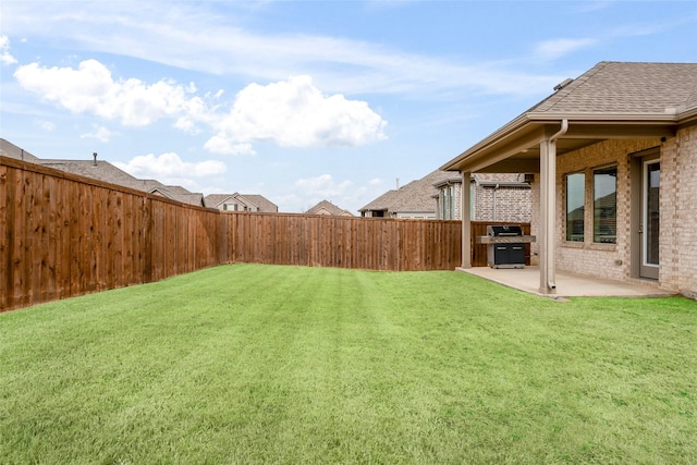 view of yard with a fenced backyard and a patio