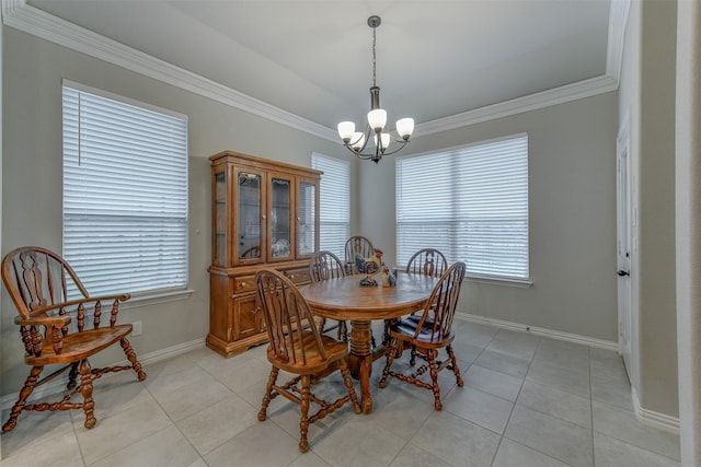 dining room with ornamental molding, light tile patterned flooring, baseboards, and an inviting chandelier