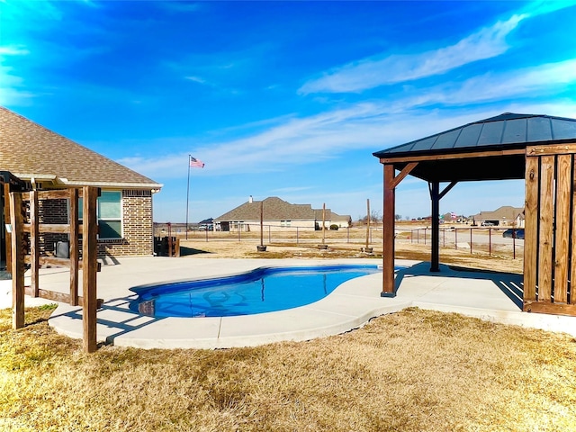 view of swimming pool with a patio area, fence, a fenced in pool, and a gazebo