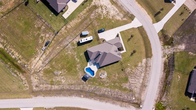 birds eye view of property with a rural view