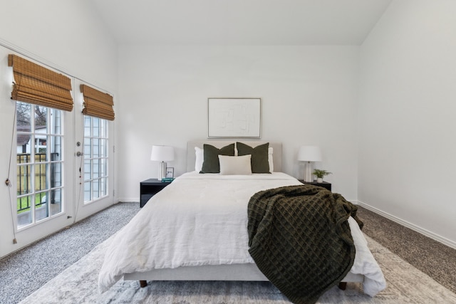 carpeted bedroom with access to outside and french doors