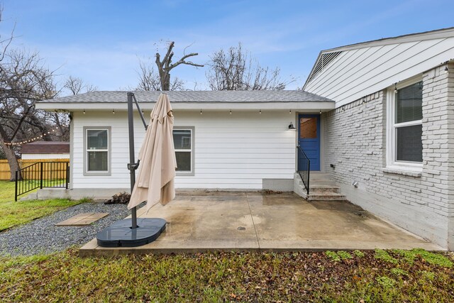 property entrance with a patio area