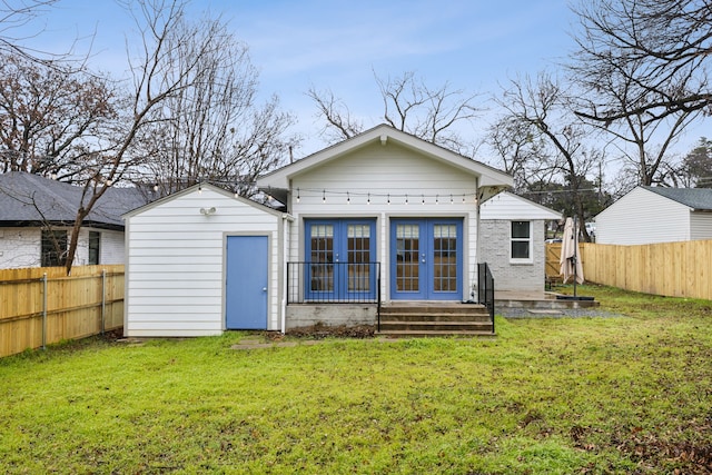 back of house with a yard