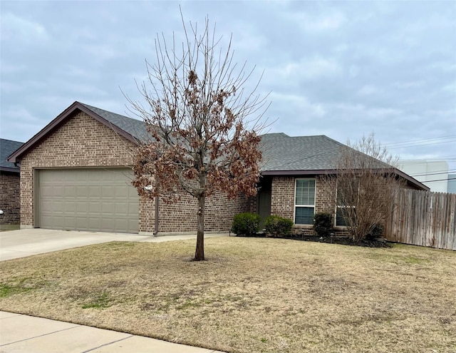 ranch-style house featuring a garage and a front lawn