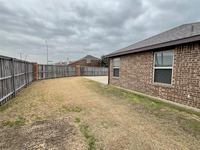 view of yard with a patio area