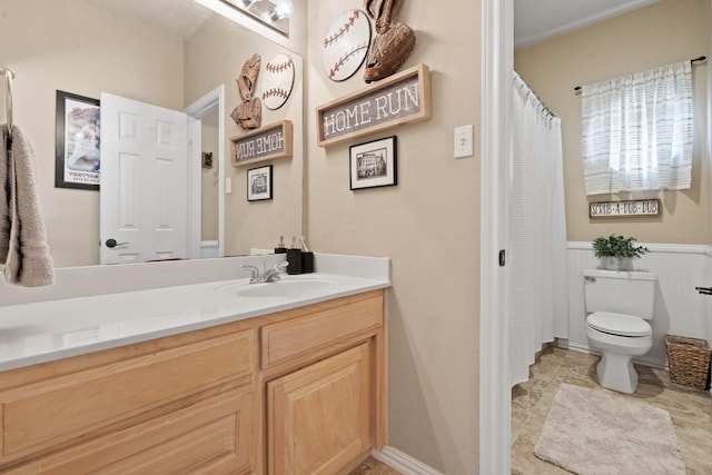 bathroom with vanity and toilet