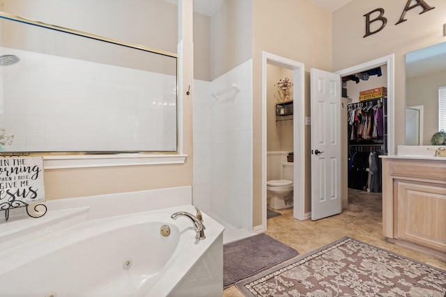 full bathroom featuring vanity, separate shower and tub, and toilet