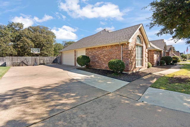 view of side of home with a garage