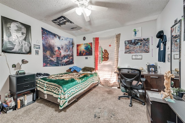 bedroom featuring ceiling fan, a textured ceiling, and carpet flooring