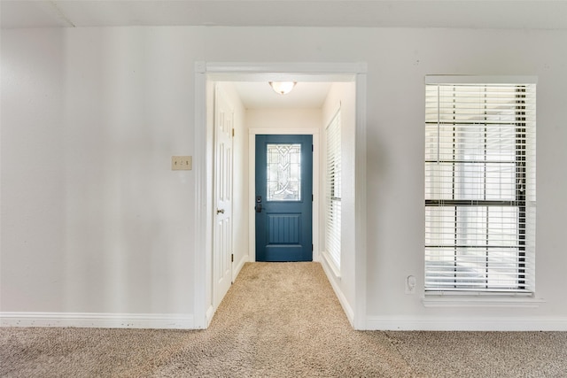 foyer with carpet flooring