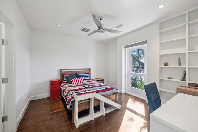 bedroom with dark hardwood / wood-style floors and ceiling fan