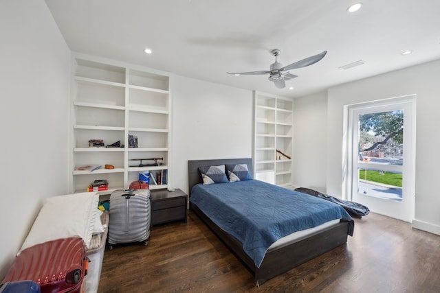 bedroom with ceiling fan and dark hardwood / wood-style flooring