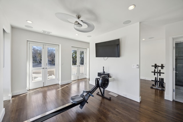 workout room with dark wood-type flooring and french doors