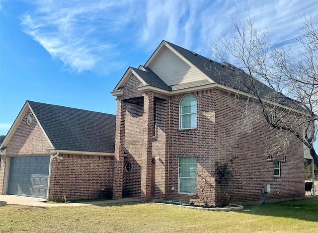 view of front of home featuring a garage and a front lawn