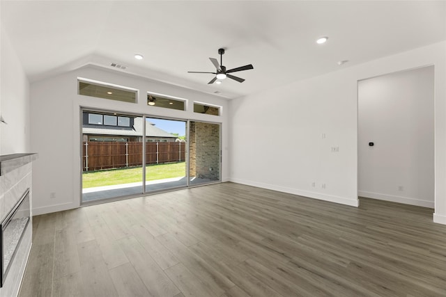 unfurnished living room with visible vents, baseboards, a tiled fireplace, a ceiling fan, and wood finished floors