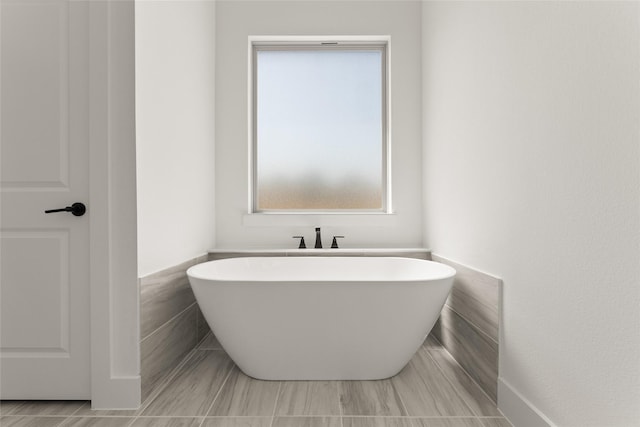 bathroom featuring a freestanding tub