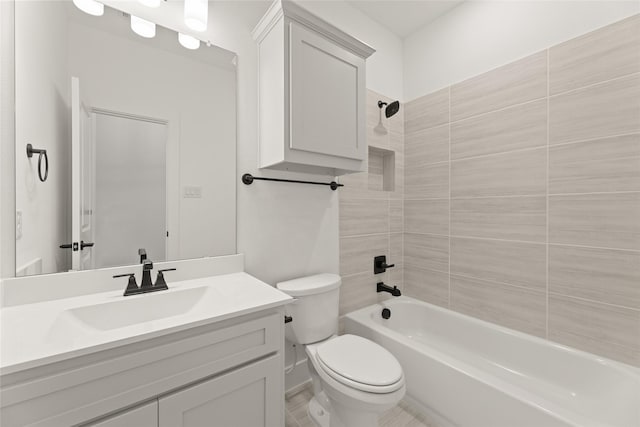 bathroom featuring toilet, shower / tub combination, and vanity