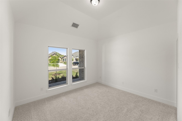 unfurnished room featuring visible vents, baseboards, and carpet
