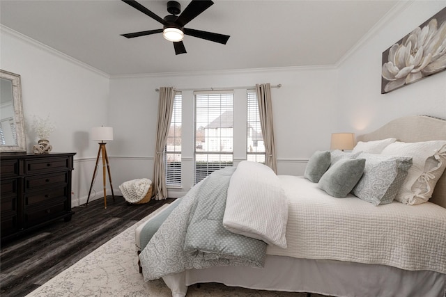 bedroom with crown molding, ceiling fan, and dark wood-type flooring