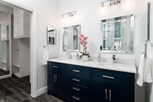 bathroom featuring vanity, hardwood / wood-style floors, and an enclosed shower