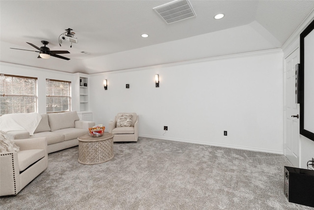 carpeted living room with a ceiling fan, recessed lighting, baseboards, and built in shelves