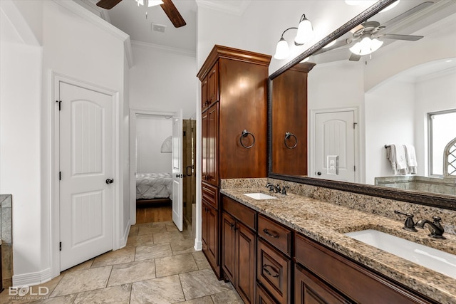 bathroom with vanity, crown molding, and ceiling fan