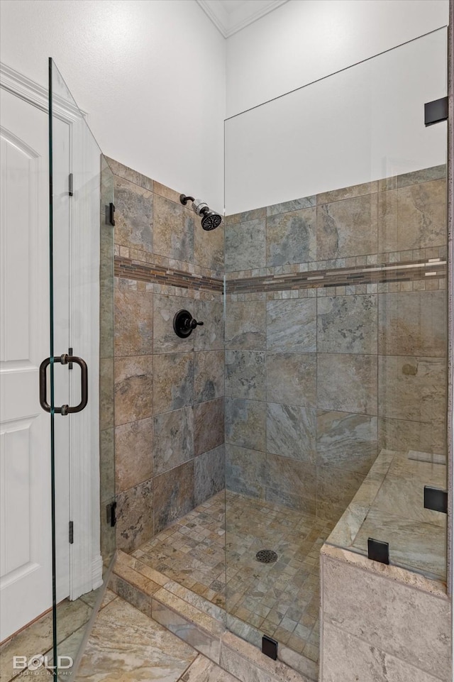 bathroom featuring a shower with shower door