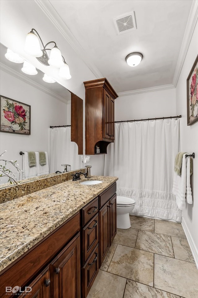 bathroom featuring crown molding, vanity, and toilet