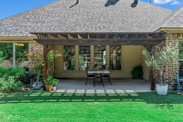 back of property featuring a patio, a yard, and a pergola