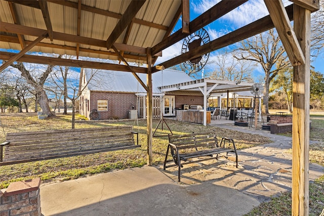 view of patio / terrace featuring a gazebo and exterior kitchen