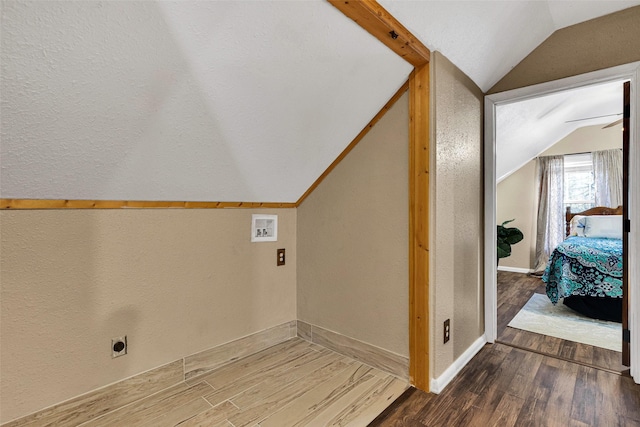 clothes washing area featuring hookup for a washing machine, hardwood / wood-style flooring, and hookup for an electric dryer