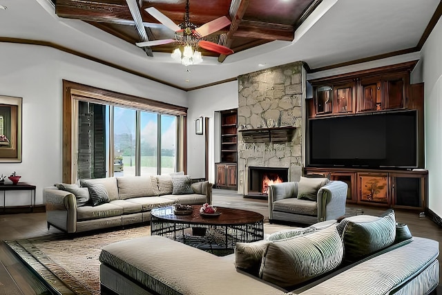 living room featuring a fireplace, coffered ceiling, wood finished floors, and crown molding