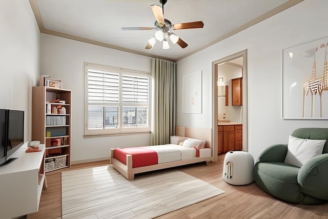 bedroom with baseboards, ensuite bath, ceiling fan, ornamental molding, and light wood-type flooring