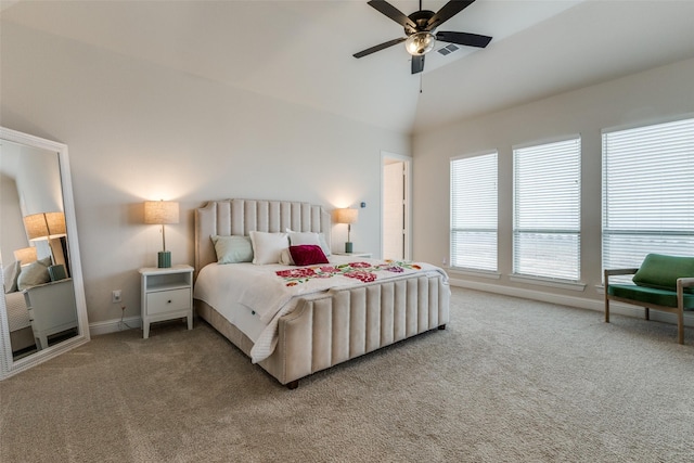 bedroom featuring lofted ceiling, ceiling fan, and carpet flooring