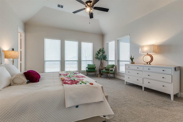 carpeted bedroom featuring lofted ceiling and ceiling fan