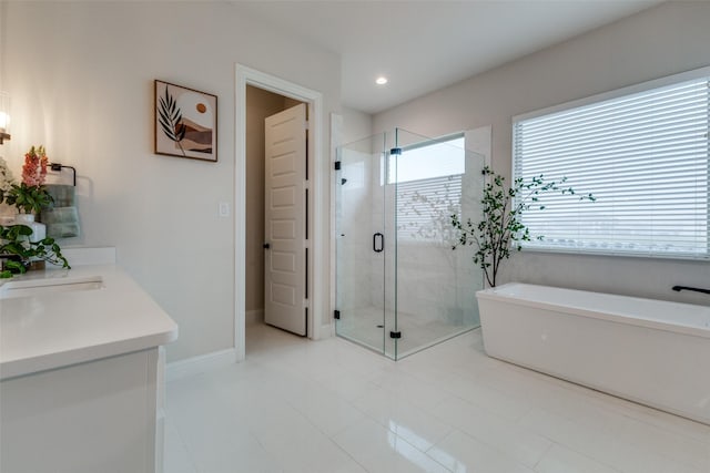 bathroom with vanity and plus walk in shower