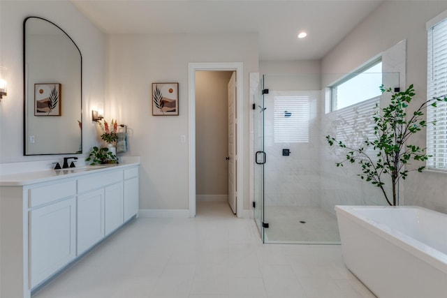 bathroom featuring vanity and separate shower and tub