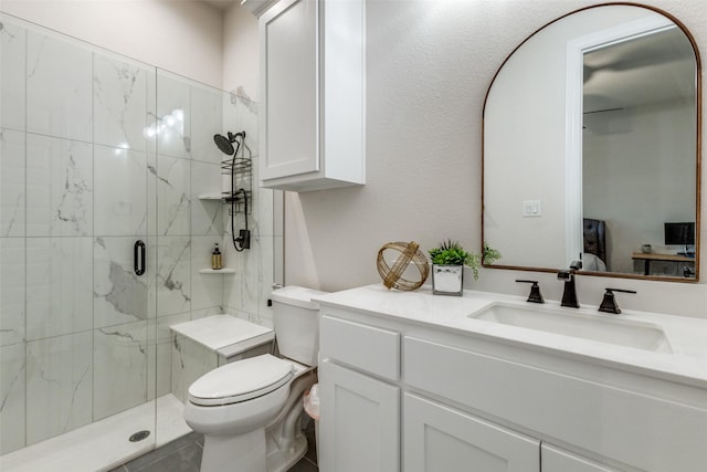 bathroom with vanity, toilet, and walk in shower