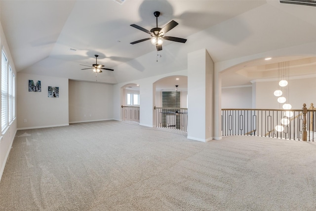 unfurnished living room featuring vaulted ceiling and carpet