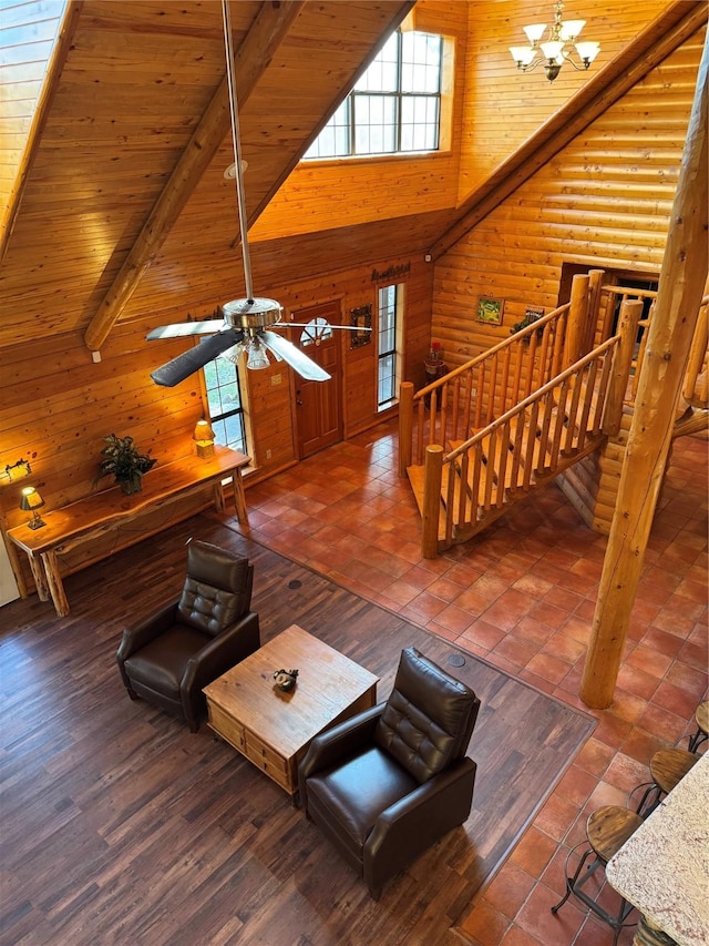 unfurnished living room with wooden ceiling, a wealth of natural light, a notable chandelier, and beam ceiling