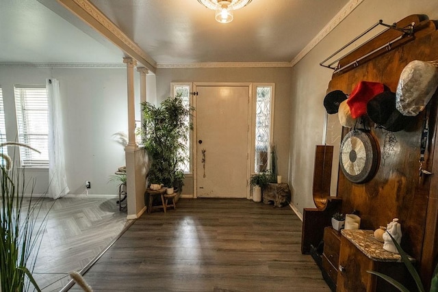 foyer entrance with ornamental molding and ornate columns