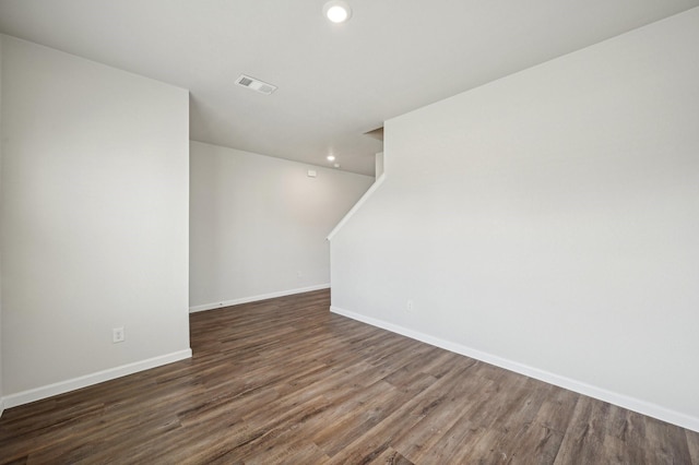 spare room featuring dark hardwood / wood-style flooring